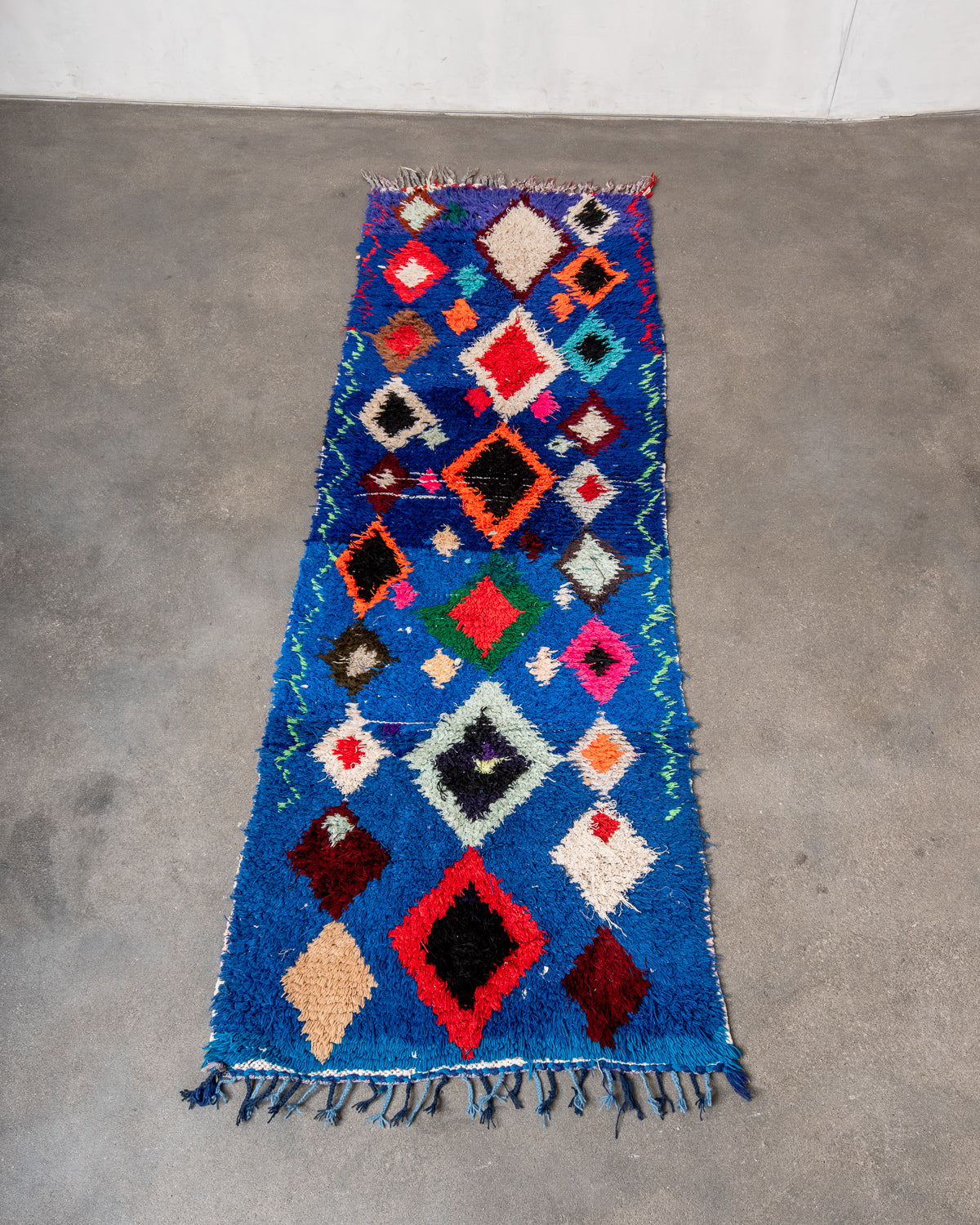 Modern designer vintage handcrafted Berber rug from Morocco. Boucherouite runner rug with beautiful colors and patterns.